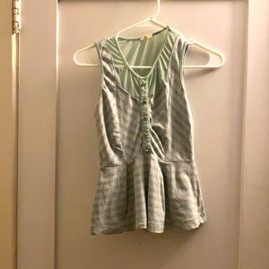 Sheer, striped and button decorated tank